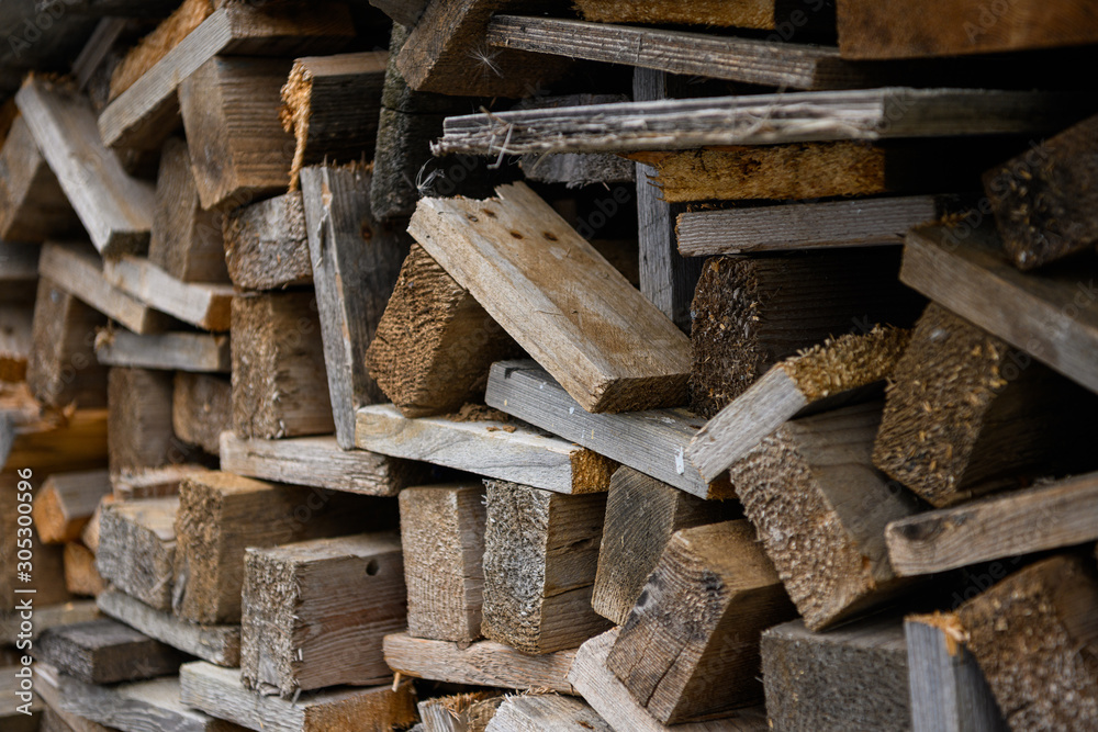 Piles of old wooden boards in the sawmill, planking. Wood timber stack of wooden blanks construction material. Industry. Piles of old wooden boards in the sawmill, planking. Wood timber stack of wooden blanks construction material. Industry.