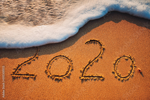 Happy New Year 2020 concept on the sea beach; sunrsie shot photo