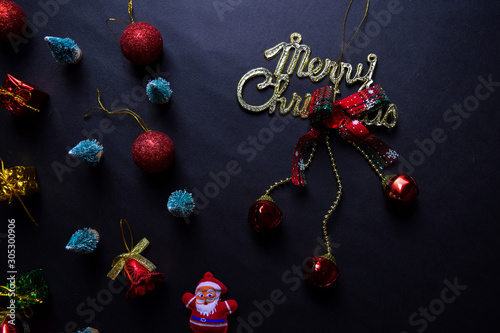 Santa Claus, merry christmas text and Decorative Christmas isolated on black background