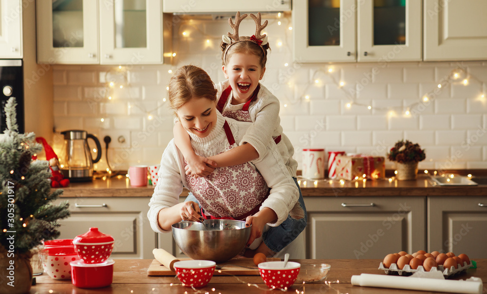 happy family mother and child bake christmas cookies. - obrazy, fototapety, plakaty 