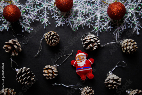 Fototapeta Naklejka Na Ścianę i Meble -  Decorative Christmas and santa claus isolated on black background