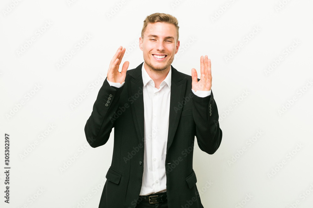 Young caucasian business man joyful laughing a lot. Happiness concept. Young caucasian business man joyful laughing a lot. Happiness concept.