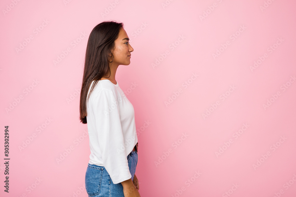 Young mixed race indian woman gazing left, sideways pose. Young mixed race indian woman gazing left, sideways pose.