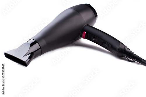 Black hair dryer on white background. Electric hair dryer. Space for text.