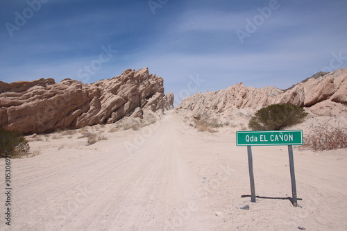 A road crosses between the rocky peaks of La Quebrada de las flechas, Argentina
