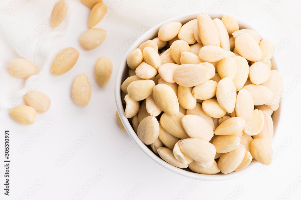 Bowl of almonds on a white background Bowl of almonds on a white background