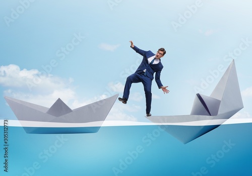 Businessman escaping sunken paper boat ship © Elnur