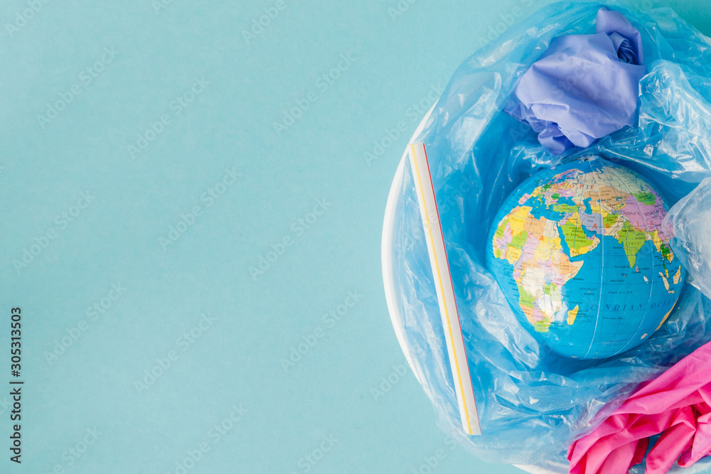 The concept of reducing plastic bags use: Modeled globes are sunk in many white plastic bags. Meaning, plastic bags are about to overflow the world - obrazy, fototapety, plakaty 