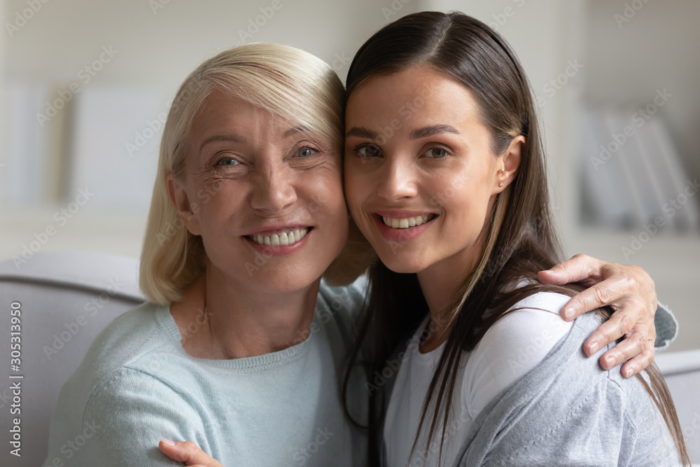 Close up image multi-generational female family portrait Close up image multi-generational female family portrait