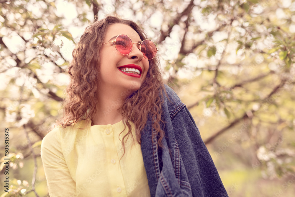 Optimistic woman resting in spring garden
