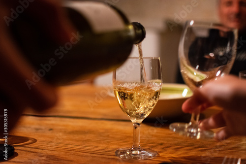 pouring glass of wine