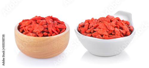 dried goji berries in a bowl on white background photo