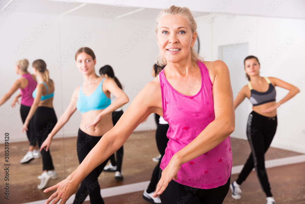 Fototapeta premium Group of smiling people of different ages dancing