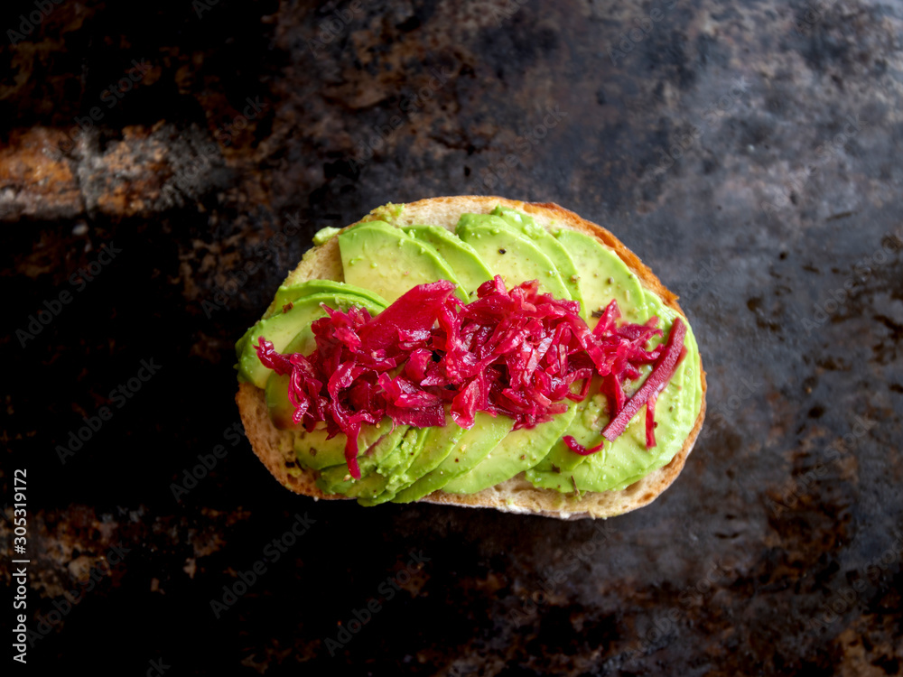 Sauerkraut on the top of avocado and sourdough bread Sauerkraut on the top of avocado and sourdough bread