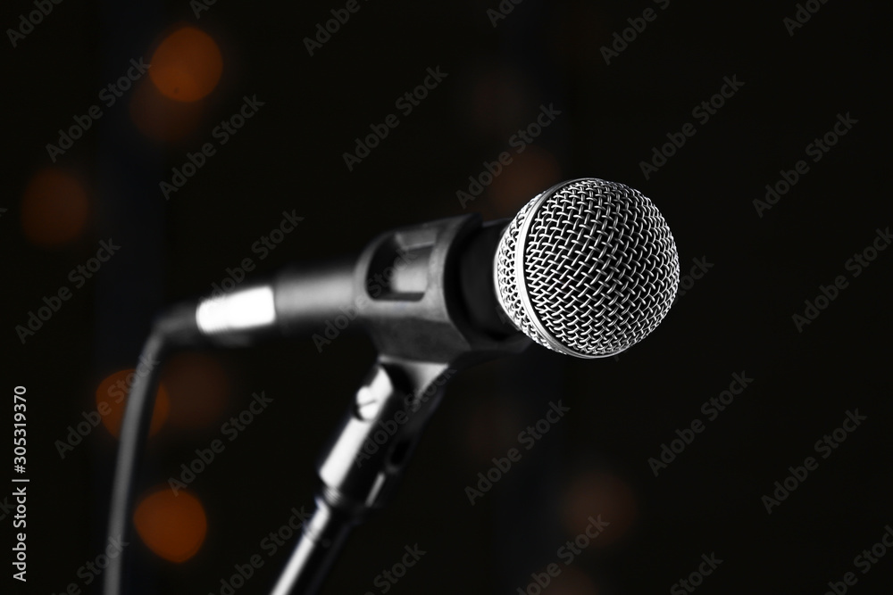 Microphone on dark background with defocused lights Microphone on dark background with defocused lights