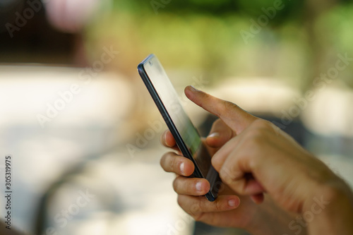 Man using smartphone. Surfing in the net