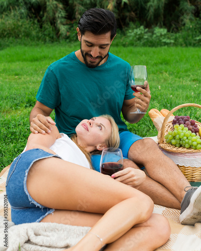 Woman is lying on the lap of boyfriend in time picnic © JackF