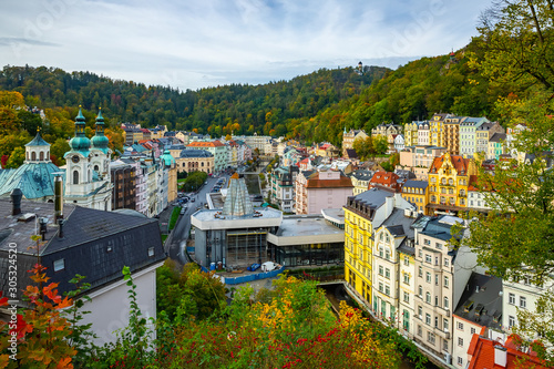 Photo Karlovy Vary with church and hot spring colonnade, Czech Republic
