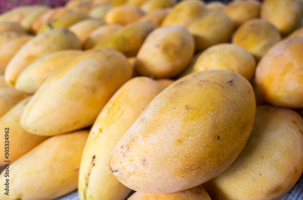 yellow stacks of mango fruits