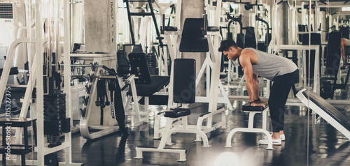 caucasian man having arms and hands stretching and body warm up in gym