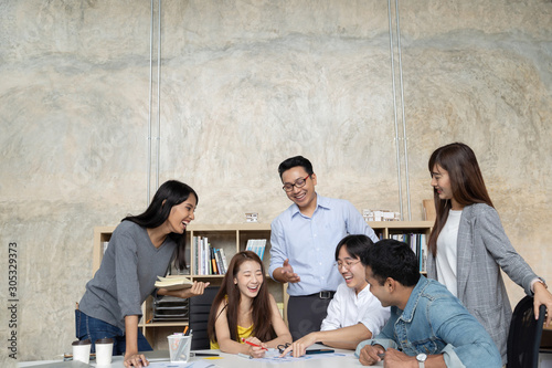 Group of Asian business people team meeting in modern office working design planning and ideas concept