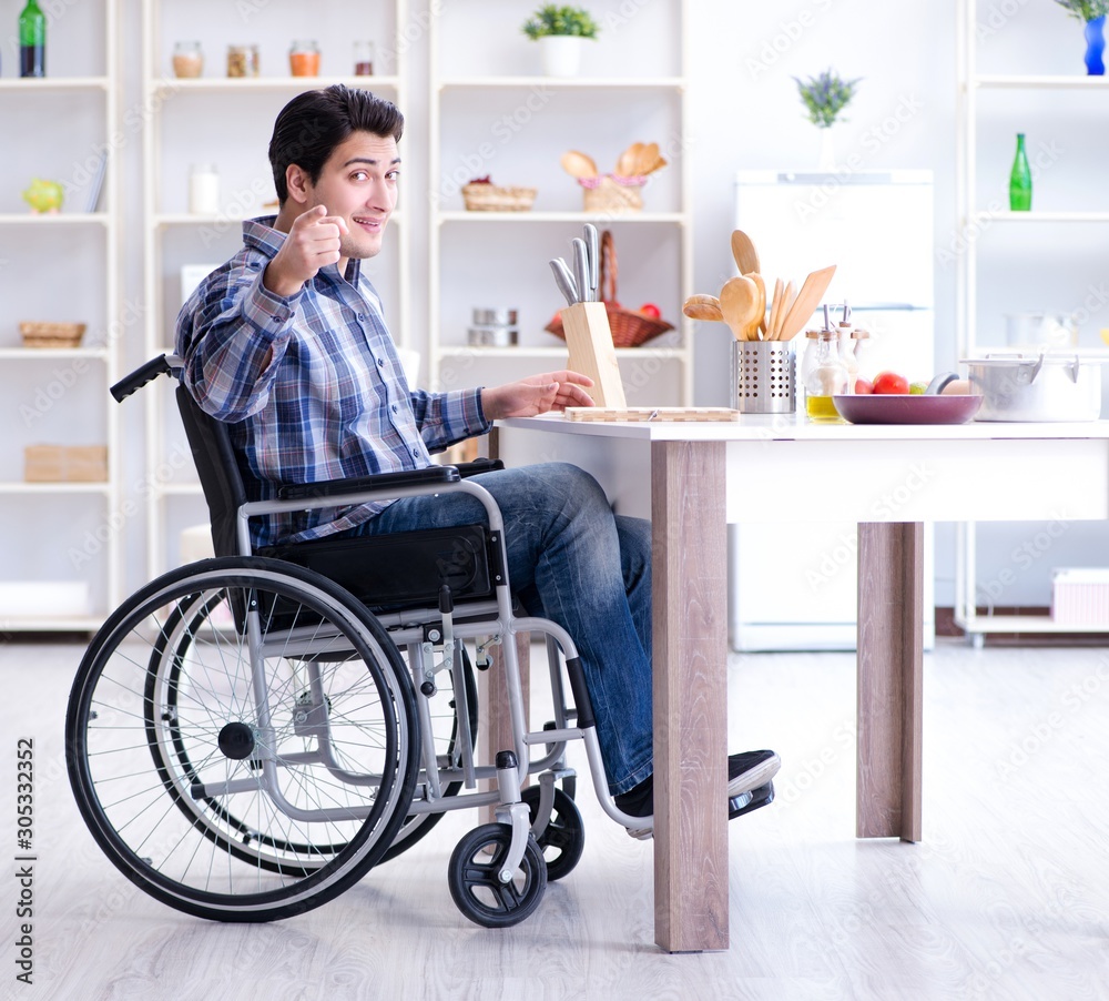 Disabled young man husband working in kitchen