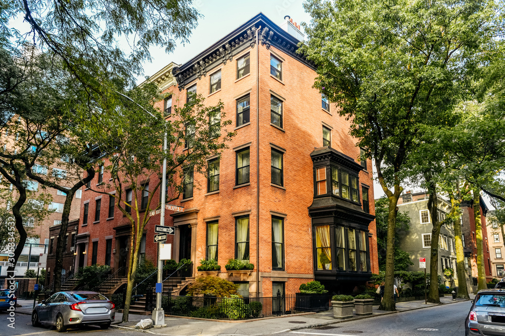 Naklejka premium Brownstone facades & row houses at sunset in an iconic neighborhood of Brooklyn Heights in New York City