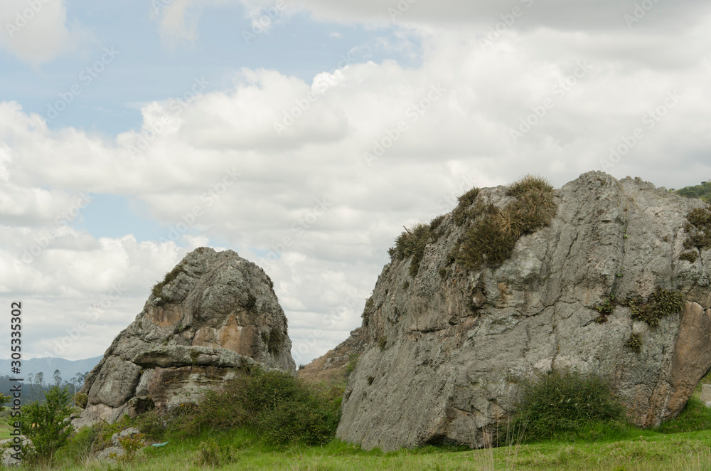 Landscape with boulders and cloudy sky Landscape with boulders and cloudy sky