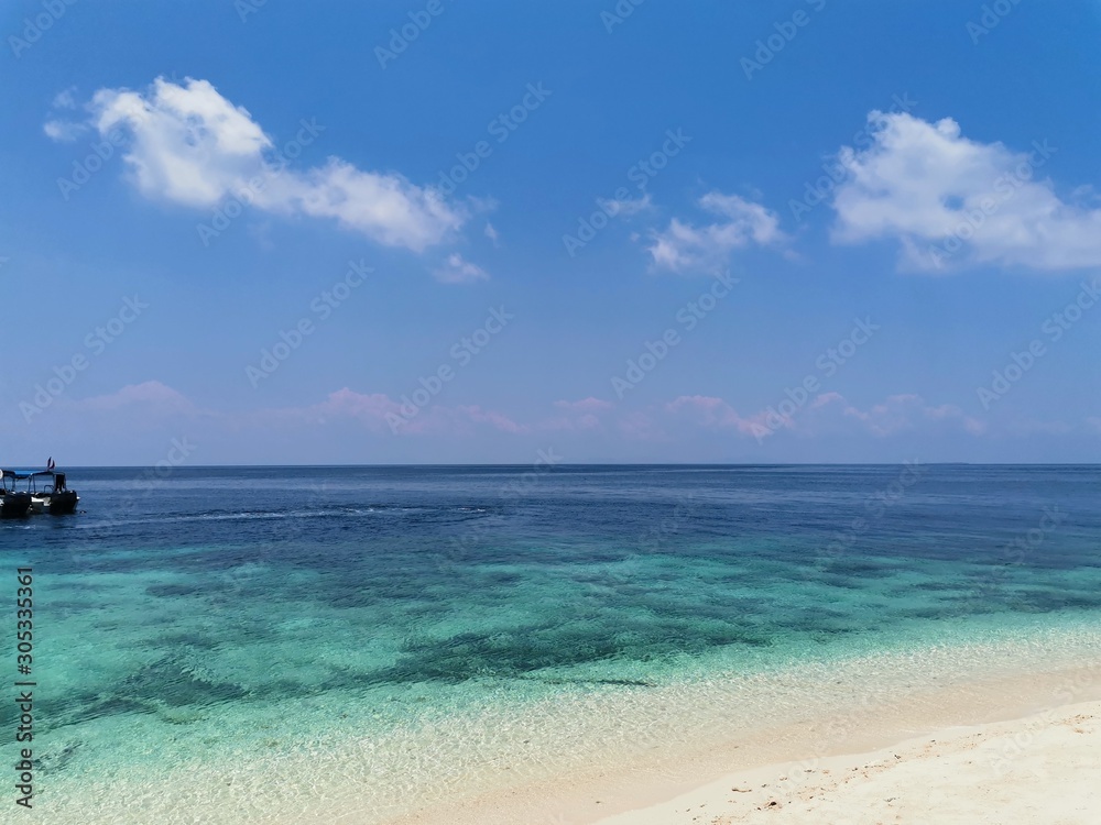 Beautiful blue sky and crystal clear water in Sipadan Island, Semporna. Sabah, Malaysia. Borneo. The Land Below The Wind.