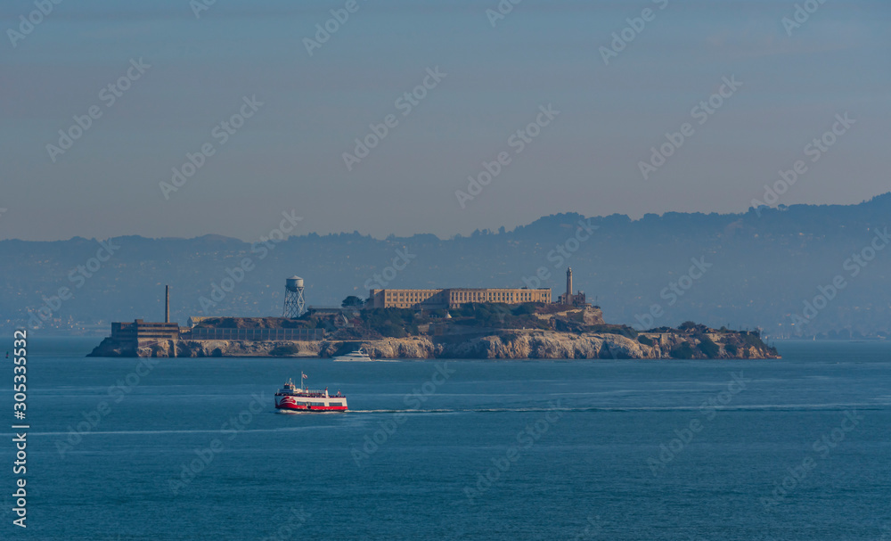 Alcatraz Island on a nice day with boats in the bay around San Francisco, Ca.
