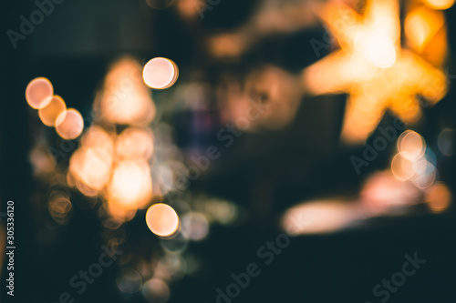 abstract bokeh living room decorate with ball and string lights at night chrismas time.Holiday celebration festival