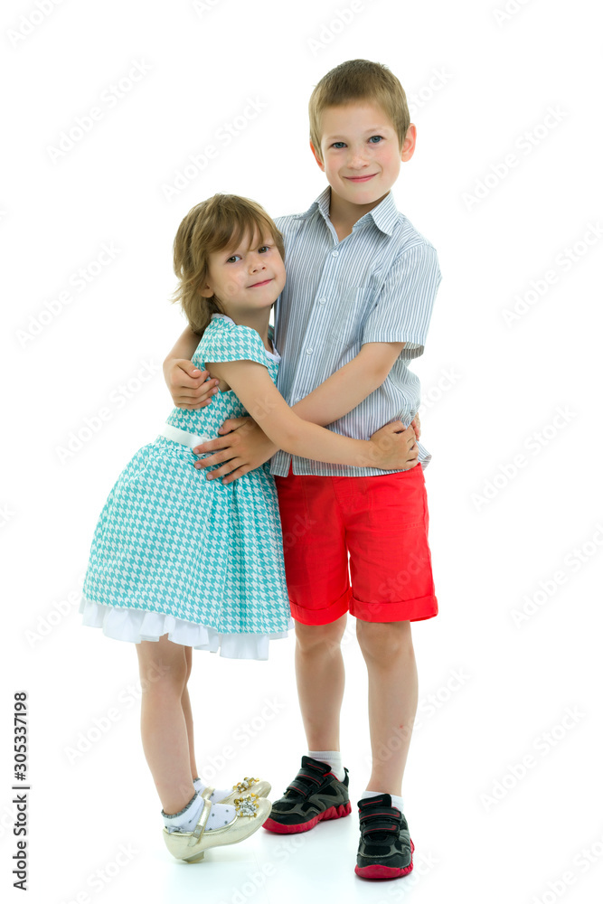 Boy and girl brother and sister gently hug Boy and girl brother and sister gently hug