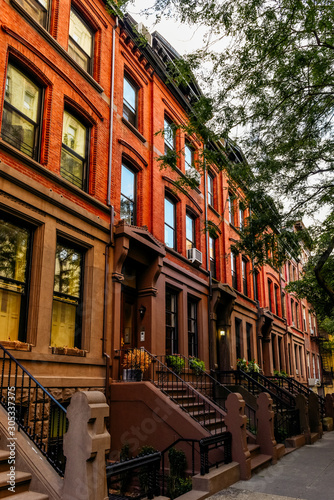 Brownstone facades & row houses at sunset in an iconic neighborhood of Brooklyn Heights in New York City © auseklis
