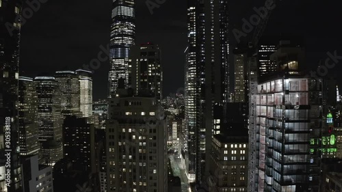 Aerial rise near manhattan skyscrapers in the dark