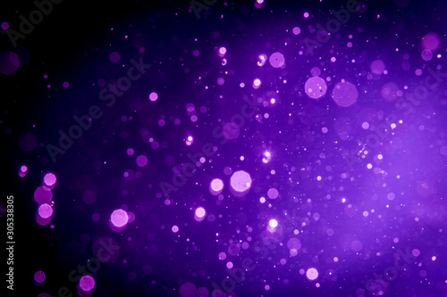 Abstract purple , violet bokeh on black