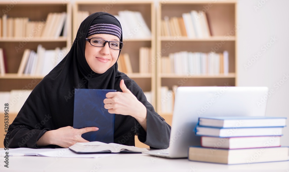 Muslim girl in hijab studying preparing for exams Muslim girl in hijab studying preparing for exams