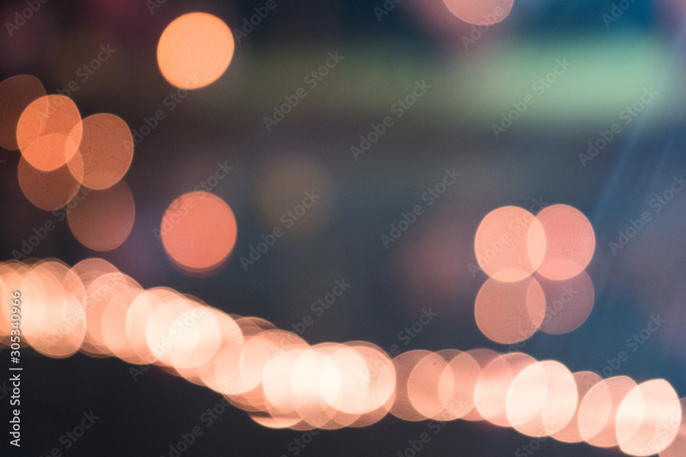 Fototapeta Blurred background of colored lights