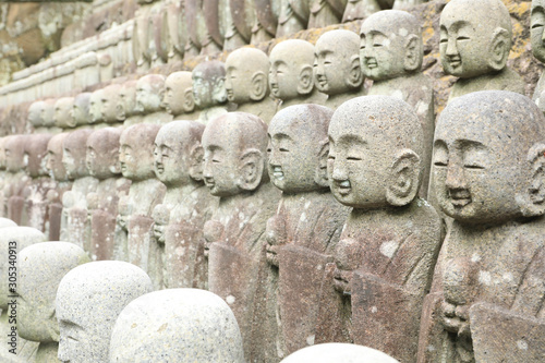 roll of Jizo Bodhisattva statues or statutes of baby buddha sat Hase-dera temple in Kamakura, Japan