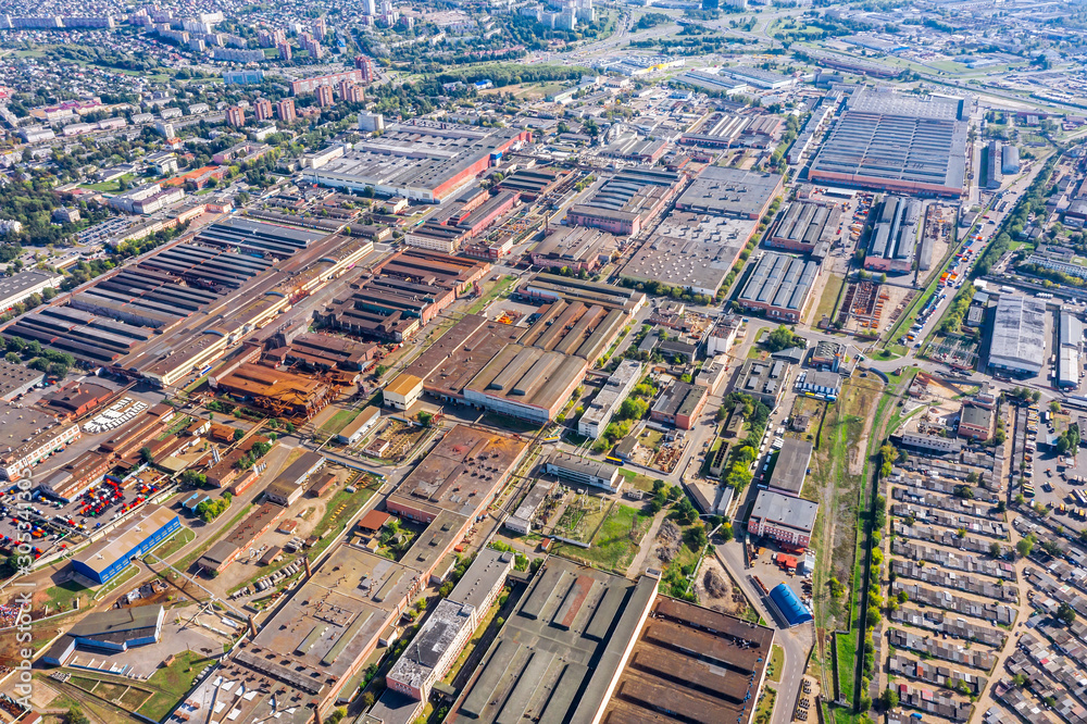 aerial view of factory or plant industrial area with many industrial buildings in city outskirts