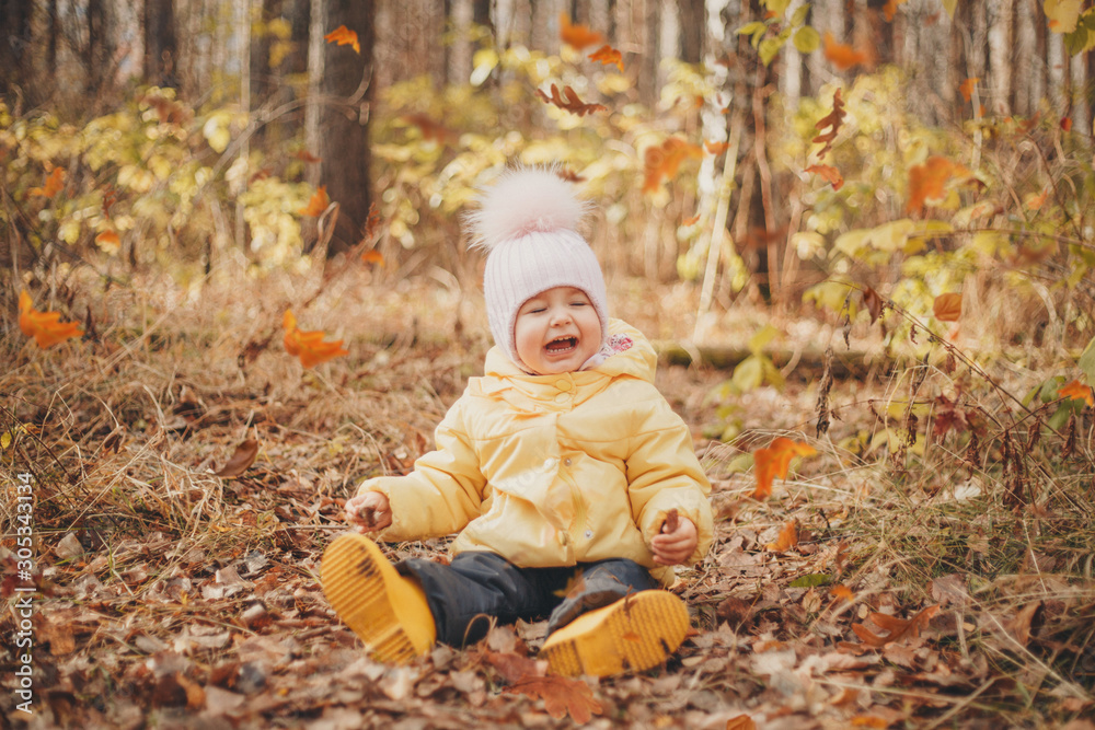 child funs in the woods. autumn park. The concept of fashion, accessories, outdoor walks child funs in the woods. autumn park. The concept of fashion, accessories, outdoor walks