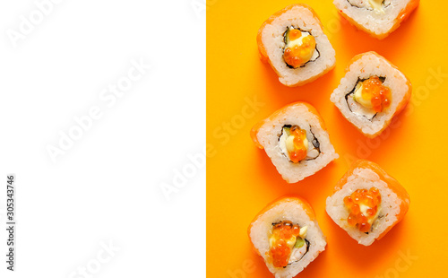 Japanese rolls on yellow background.