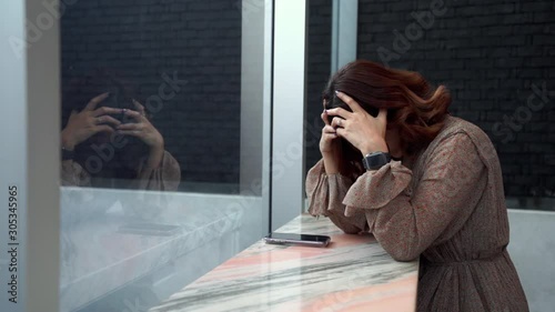 slow-motion of depressed young woman having headache, feeling sad, worry about problem