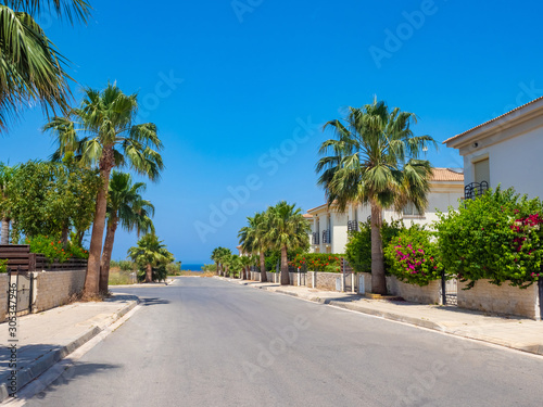 Cyprus. Pissouri village. The street leads to the sea. A picturesque street in the village of Pissouri. Houses in Cyprus. Architecture Of Cyprus. House on the coast of the Mediterranean sea.