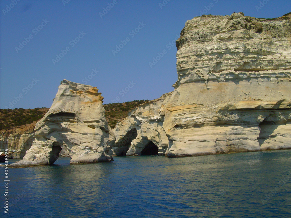 milos island in greece, kleftiko bay rock caves, sea swimming sailing in summer holidays