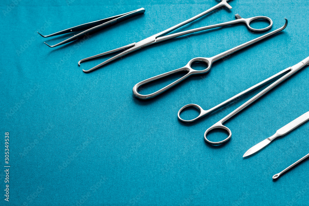 Instruments for plastic surgery on blue background flat lay Instruments for plastic surgery on blue background flat lay