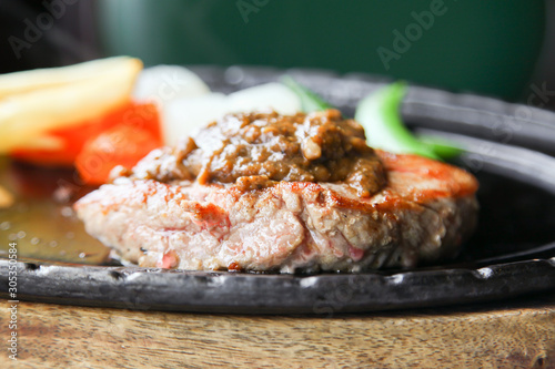 Grilled tenderloin beef steak with black pepper sauce