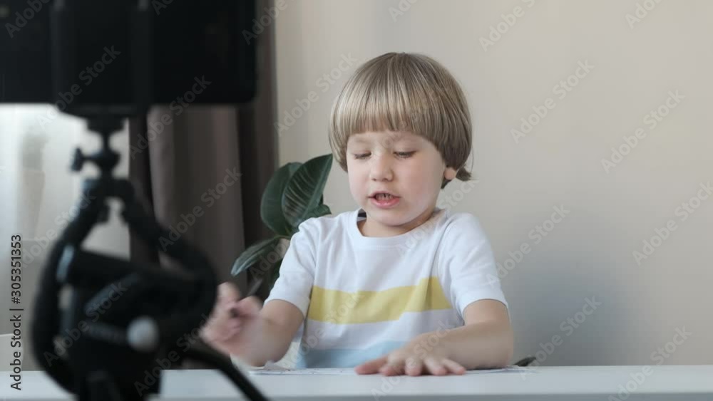 Little cute blogger shooting video for social media with smartphone Little cute blogger shooting video for social media with smartphone