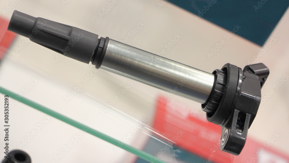 Car modern engine ignition coil close up