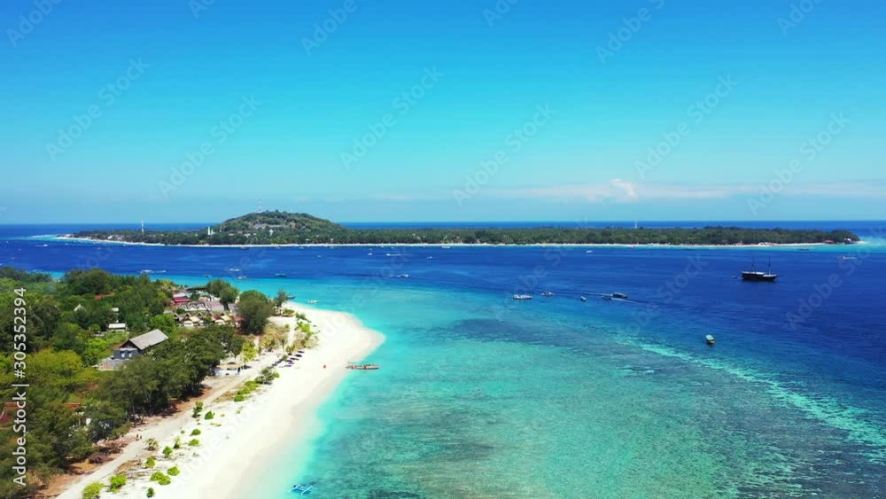 Islands In Samoa - Tropical Paradise Islands Fringed With Green Trees And White Sand, Surrounded By Turquoise Ocean Water, Boats Sailing On The Deep Blue Waters Under The Bright Sky - Aerial Shot Islands In Samoa - Tropical Paradise Islands Fringed With Green Trees And White Sand, Surrounded By Turquoise Ocean Water, Boats Sailing On The Deep Blue Waters Under The Bright Sky - Aerial Shot