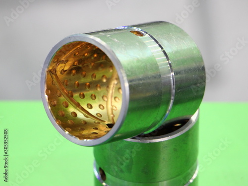 New plain bearing sleeve with lubrication hole close-up photo